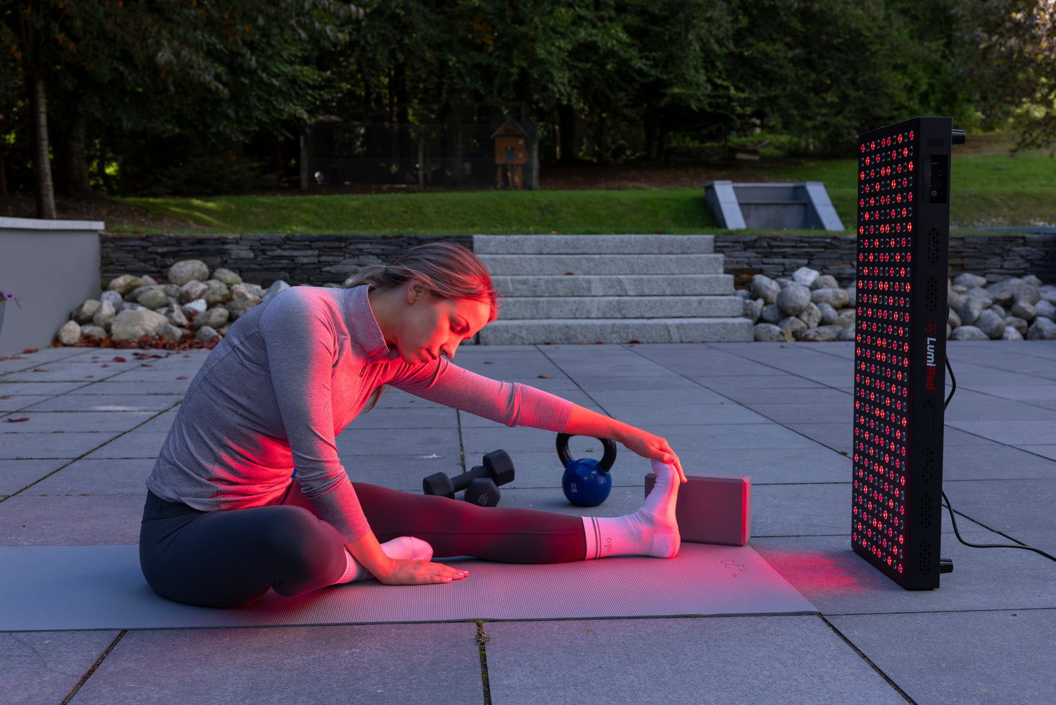 woman exercising and getting red light therapy